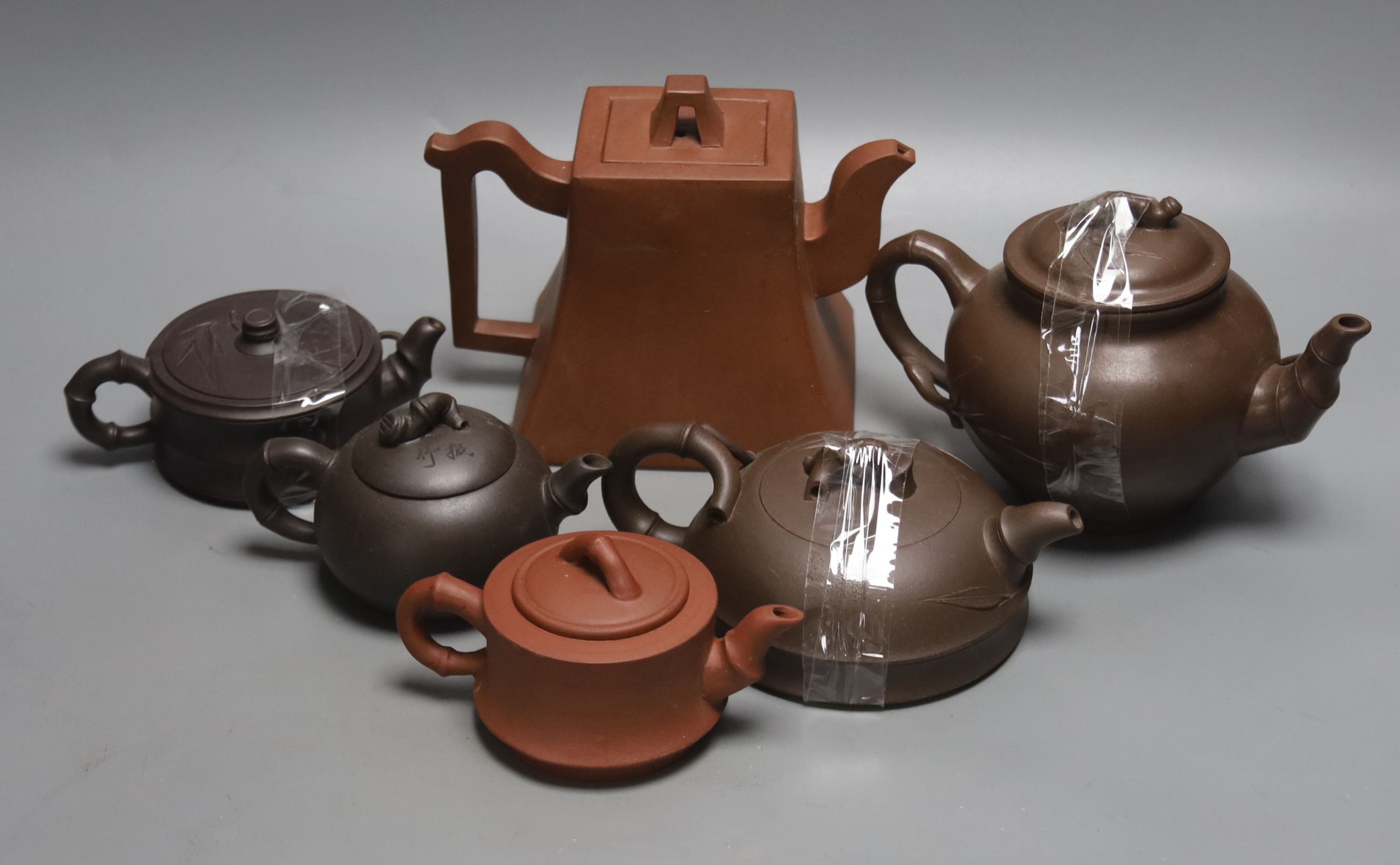 Six Chinese Yixing teapots and covers, tallest 14cm